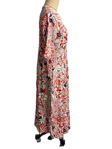 Detailed side view of an elegant floral V-neck maxi dress on a professional mannequin