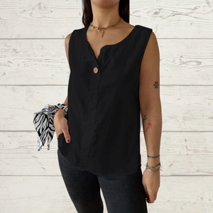 Detail view of black V-neck cotton linen tank top with button detail and casual texture