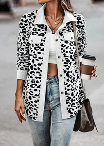 Detailed close-up of leopard print corduroy jacket fabric with button and pocket detail