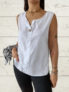 Women's white sleeveless V-neck cotton linen top with a single button detail and loose fit