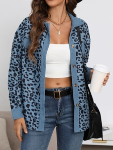 Detailed close-up showing blue corduroy fabric texture and leopard print pattern on the jacket