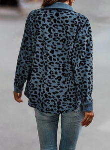Back view of women's blue leopard print corduroy jacket with long sleeves and collar