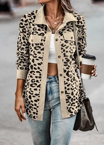Detail showing the leopard print corduroy jacket fabric texture and front chest pockets