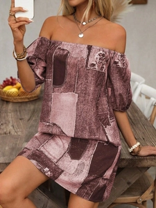 Detail of off-shoulder lantern sleeves on vintage print mini dress with floral patterns