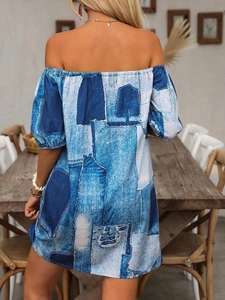 Back view of a summer off-shoulder mini dress with blue denim patchwork floral print