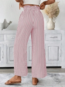 Rear view of high-waisted red and white striped wide-leg pants with a paperbag waist design