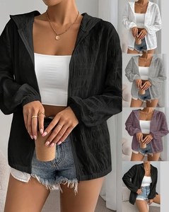 Detailed texture of women's hooded zipper jacket in white, grey, purple, and black colors