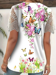 Detailed back view of lace patchwork short sleeve top with butterfly and rose print