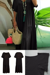 Detail view of black V-neck tiered dress showing fabric texture and short sleeve design