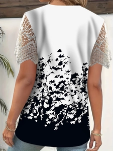 Detail of the elegant white lace hollowed sleeves on a floral print t-shirt top