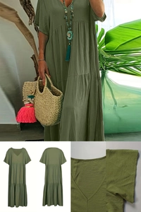 Detail of olive green V-neck dress featuring crinkle texture fabric and tiered hem