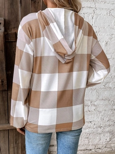 Detailed back view of a loose oversized plaid hoodie with classic brown and white patterns