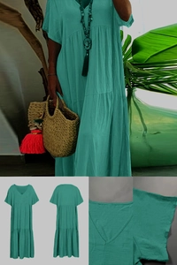 Detail of teal tiered summer dress with V-neckline and breathable cotton linen texture