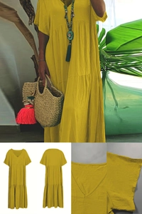 Detail view of ginger yellow V-neck tiered maxi dress with breathable cotton fabric texture