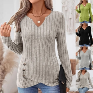 Close-up of V-neck ribbed knit top featuring side decorative buttons and asymmetric hem