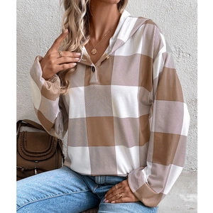Women's oversized plaid hooded sweatshirt with button neckline and long sleeves