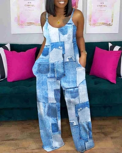 Detail view of female jumpsuit with denim patchwork print and adjustable thin straps
