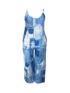 Detail of blue and white abstract print on a wide-leg sleeveless plus size jumpsuit