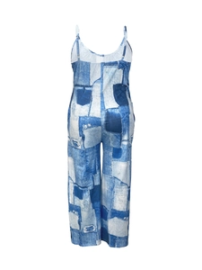 Back view of wide-leg jumpsuit with blue denim patchwork print and scoop neck straps
