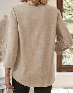 Detail view of khaki cotton-linen long sleeve top back showing fabric texture and drape