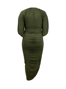 Detail of dark green maxi dress featuring elegant smocked ruched texture and lantern sleeves