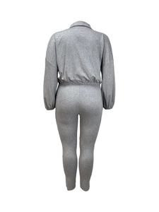 Detail of grey slim-fit two-piece set showing back view with elastic cuffs and waistband