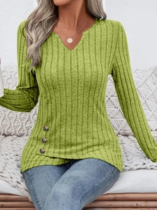 Detail of avocado green ribbed knit top with V-neck and decorative side buttons