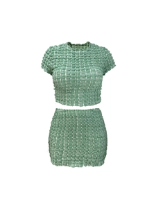 Detail of green and white plaid popcorn fabric texture on two-piece skirt set