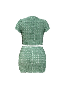 Detail of green and white seersucker checkered two-piece crop top and mini skirt set