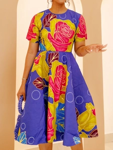 Detailed close-up of a purple floral A-line dress with vibrant pink rose prints and short sleeves