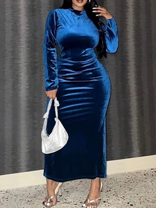 Detailed texture of navy blue velvet dress featuring elegant long sleeves and high neck