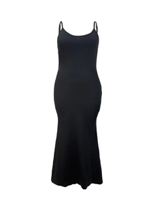 Detail view of the sleek black knitted long dress with slim shoulder straps and bodycon fit