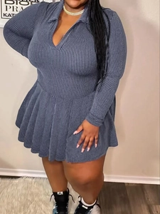 Detailed view of grey-blue ribbed V-neck plus size dress with pleated skirt design