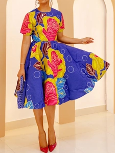 Detail of vintage navy dress with pink rose print and flared A-line skirt silhouette