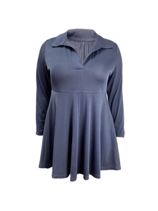 Detailed view of the ribbed corduroy texture and high waist seam of the blue v-neck dress