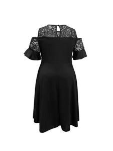 Detail of floral lace paneling on cold-shoulder back with layered ruffle sleeves