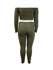 Detail view of olive green ribbed knit two-piece set with off-shoulder top and leggings