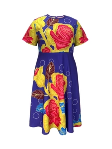 Detail of the crew neck and vibrant rose floral print on the high waist A-line dress