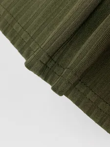 Detail of army green ribbed knit fabric showing high-quality stitching and texture
