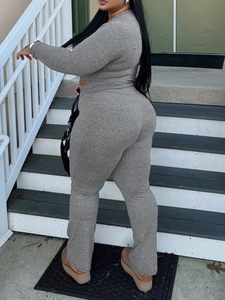 Chic grey knitted two-piece set featuring slim-fit long sleeve top and flared trousers