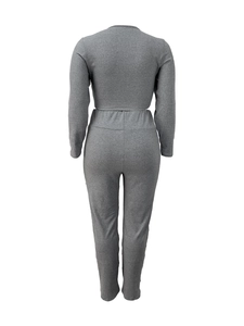 Rear view of grey slim-fit knit lounge set showing fabric texture and sleek silhouette