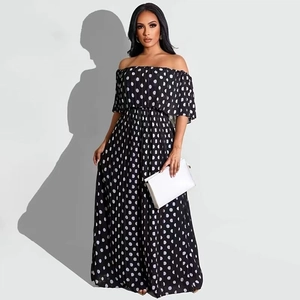 Detail of off-shoulder neckline with ruffle layers and polka dot pattern on maxi dress