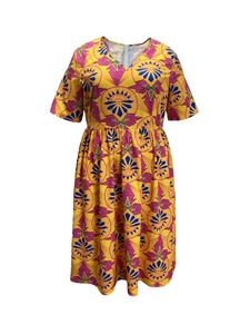 Women's plus size A-line dress with vibrant African geometric print and V-neckline