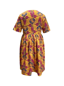Back view of a vibrant A-line African print dress with yellow and purple geometric patterns