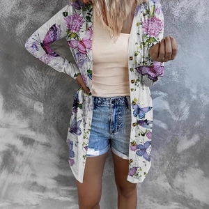 Detail of floral and butterfly print on lightweight long sleeve cardigan for women