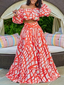 Elegant two-piece off-shoulder top and maxi skirt set with orange geometric print