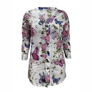 Detailed view of grey cardigan with pink floral and butterfly prints and wood-style buttons