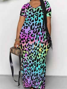 Close-up of rainbow gradient leopard print fabric on a stylish V-neck maxi dress with pockets