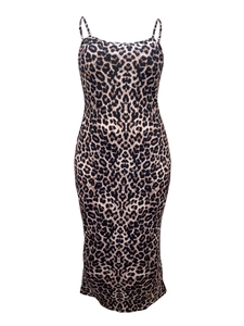 Detailed close-up of leopard print fabric and slim shoulder straps on this midi dress