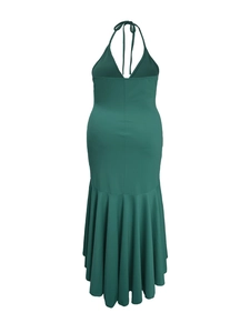 Detail of emerald green halter neck maxi dress featuring bow tie and mermaid hemline